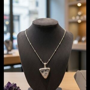 .925 18 " beaded chain with polozhed quartz pendant encased in sterling